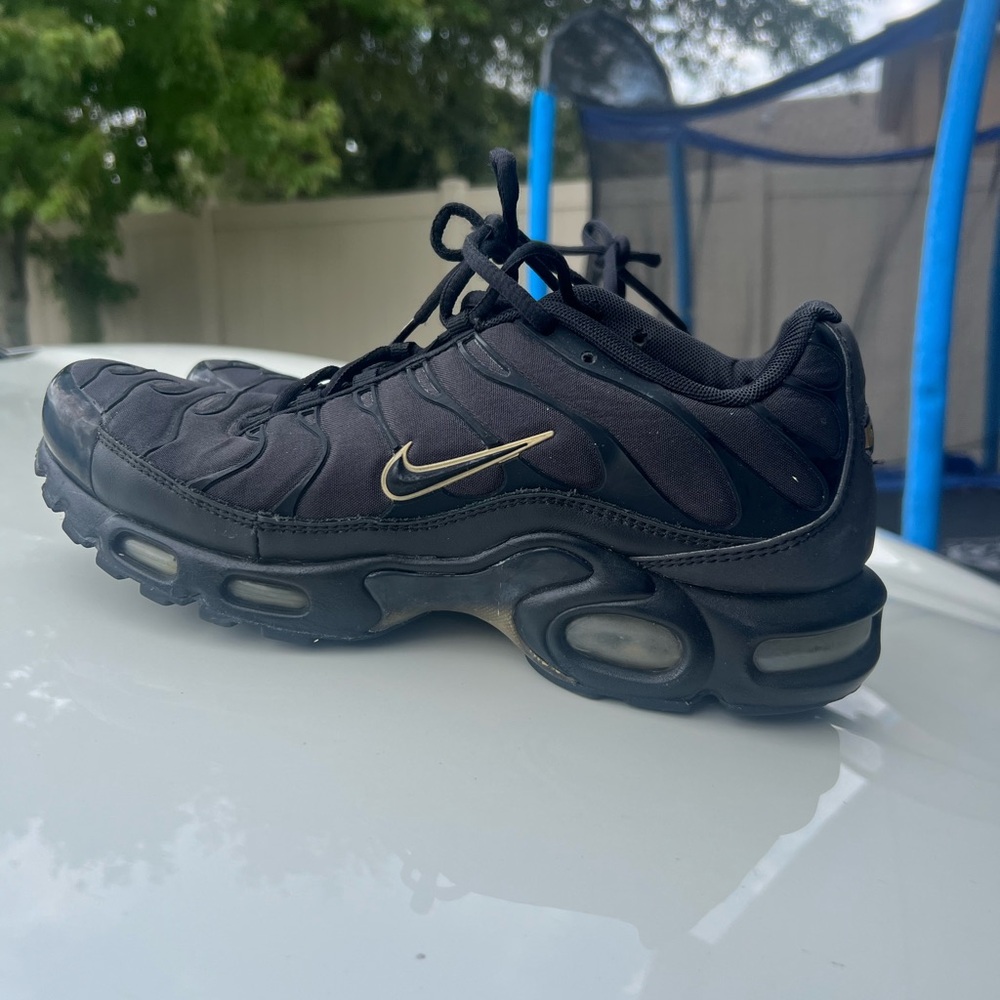 Nike Black Sneakers with Gold Swoosh